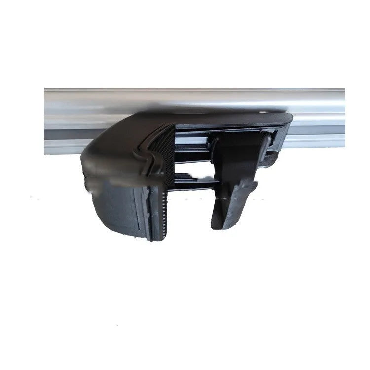 A pair of alloy roof rack crossbars for a General Motors SUV on a vehicle roof.
