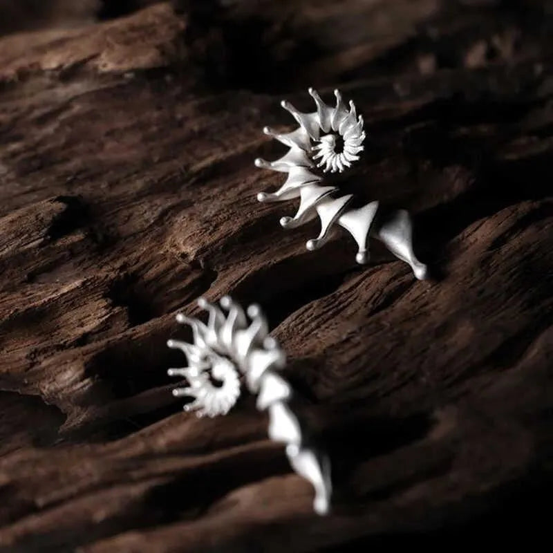 Three-dimensional matte finish conch shell stud earrings with exaggerated design and irregular patterning