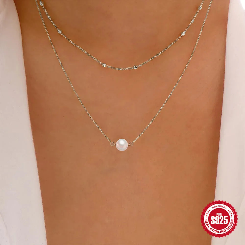 S925 sterling silver double layer necklace with twin pearls on a ball bead chain in gold colour.