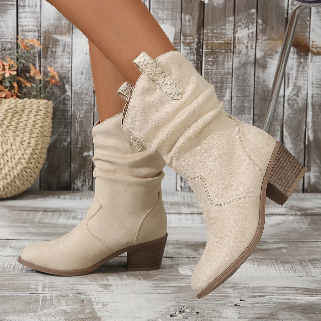 Women's suede mid-calf boot in lotus root colour with leather stitching and a short stout heel.