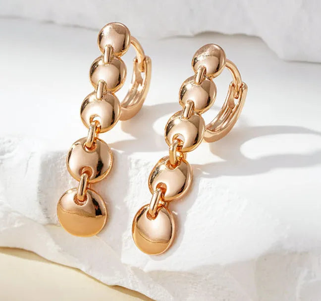 Gold retro woven circle earrings with geometric copper construction