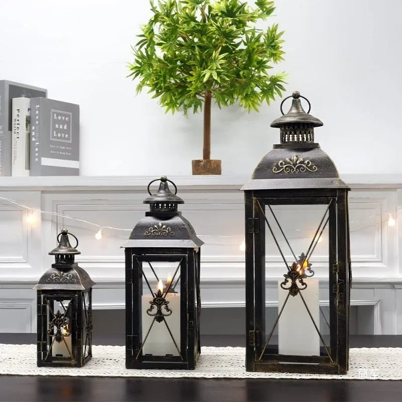 European wrought iron floor lantern with tempered glass in black gold or white gold finish, shown in small, medium, and large sizes.