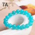 Grade 7A Amazonite natural scattered beads in ice colour showing polished surface and size variations