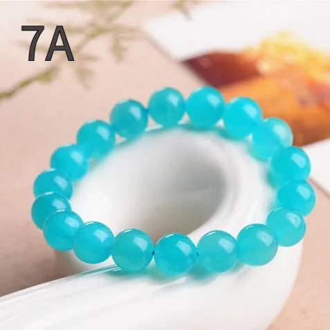 Grade 7A Amazonite natural scattered beads in ice colour showing polished surface and size variations