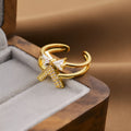 Korean fashion women's open geometric ring in electroplated gold colour on a plain background.