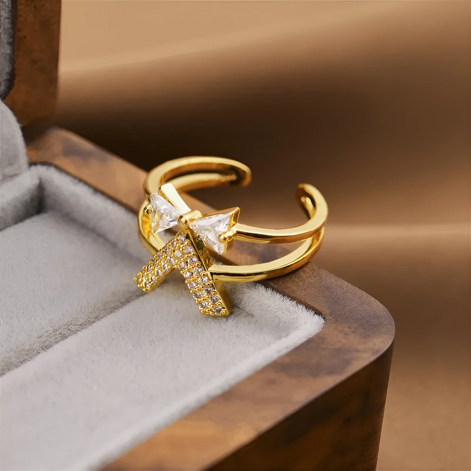 Korean fashion women's open geometric ring in electroplated gold colour on a plain background.