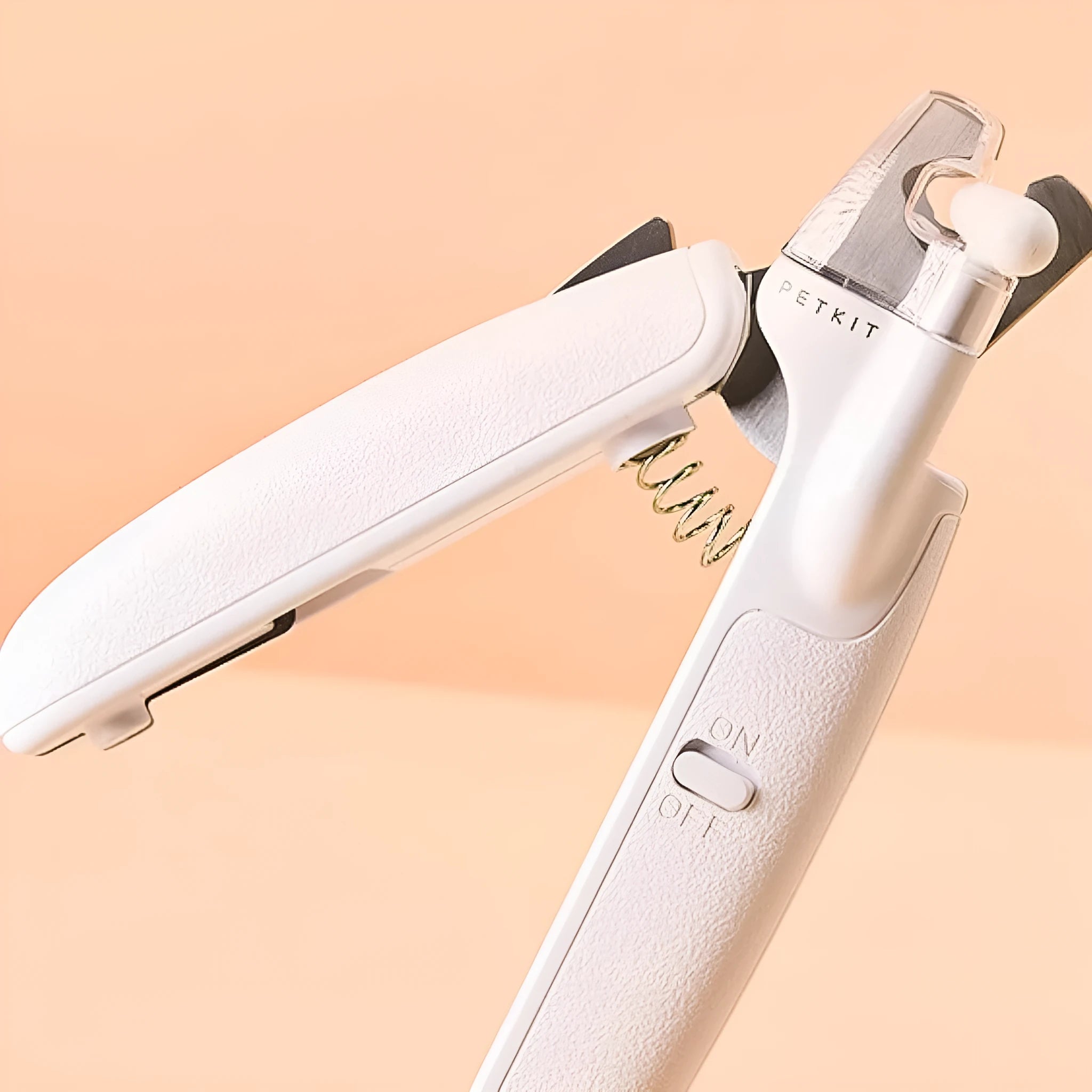 White LED pet nail clippers for dogs and cats with a transparent safety guard and leather-like handle.