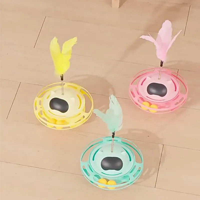 Pink cat tumbler turntable toy with self-hi feature for independent play