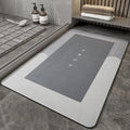 Blended fibre machine woven bathroom floor mat in blue, shown in an oval shape on a tiled floor.