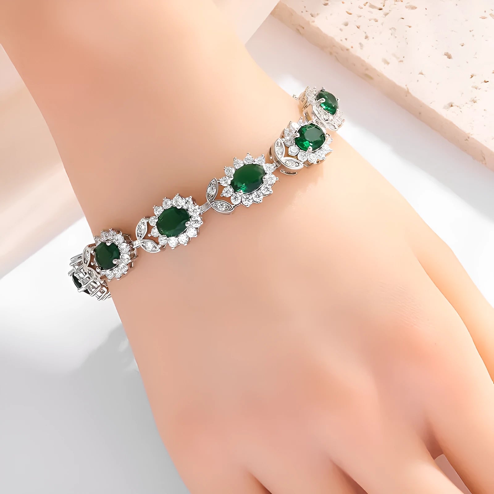 Simple women's bracelet with inlaid zircon stone on an adjustable electroplated alloy band.