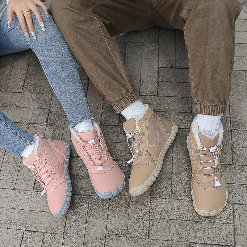 Waterproof unisex snow boots with lace-up front, fleece lining, and rubber sole in black, khaki, or pink.