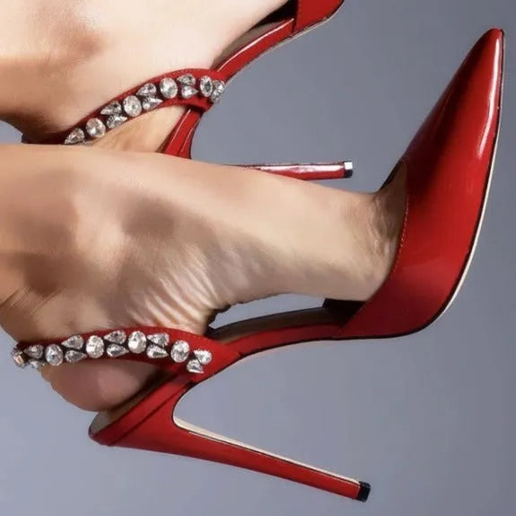 Women's black patent leather pointed toe stiletto sandals with rhinestone detail on the side, shown on a white background.