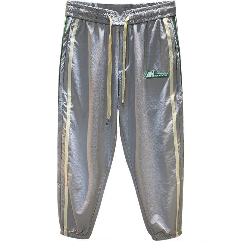 Men's black cotton harem trousers with elastic waistband shown front and back
