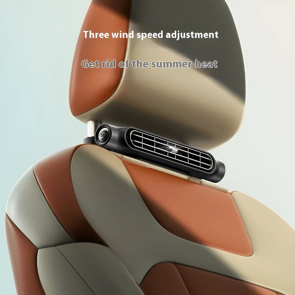 USB car fan with velcro strips mounted on a car seat, showing the no-blade design and control button.