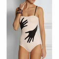 Women's one-piece bikini swimsuit with gauze skirt detail in polyester fabric.