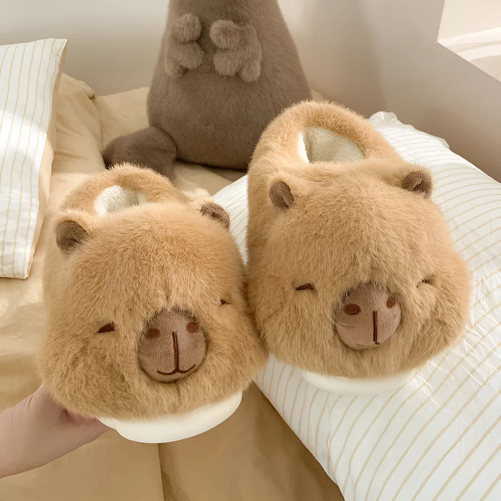 Light brown women's winter slippers with a cartoon pattern, plush upper, and round toe.