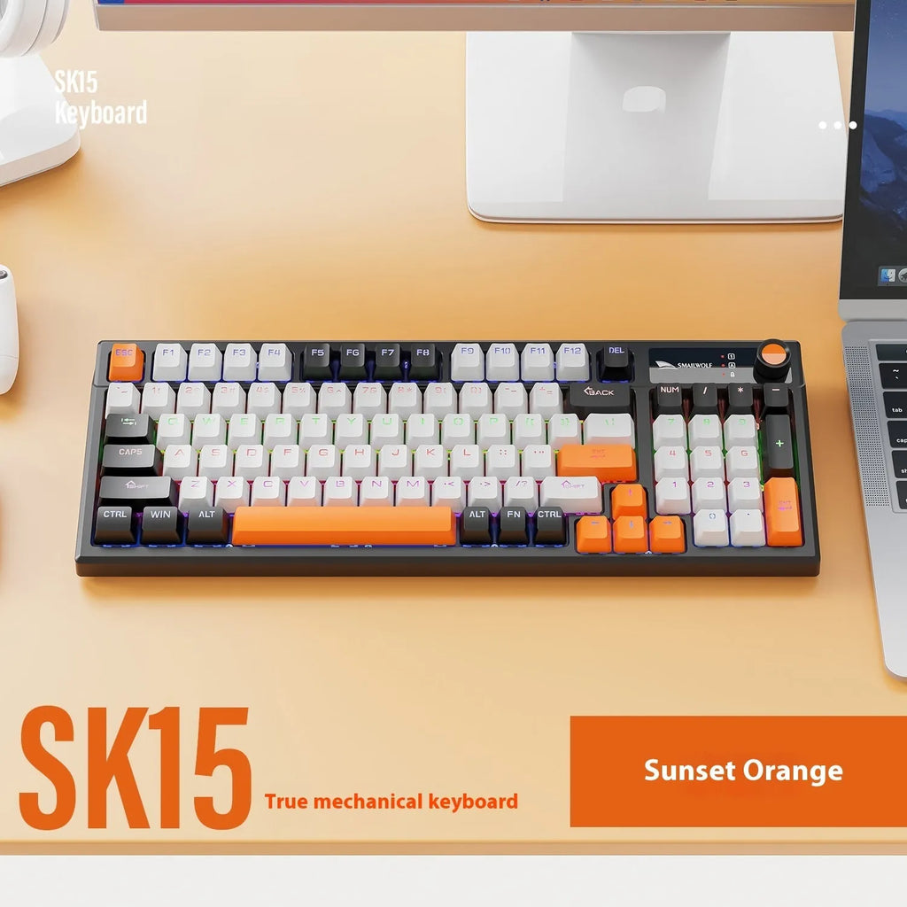 SK15 wired mechanical keyboard with control knob in sunset orange colour beside laptop