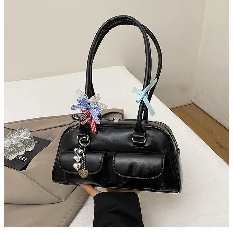 Retro PU leather pillow bag with one-shoulder design and double straps in black colour