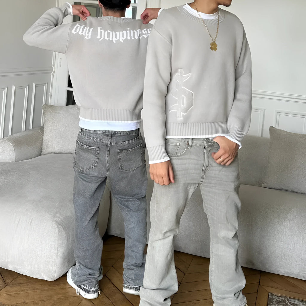 Grey loose-fitting acetate knitwear coat with jacquard pattern and long sleeves.