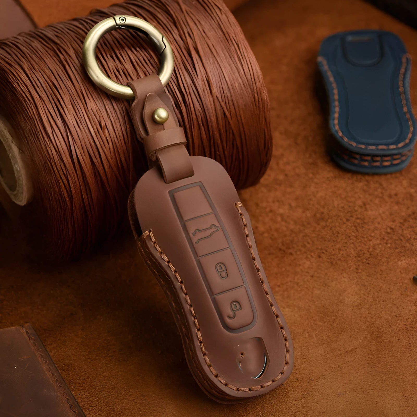 Retro style brown cowhide leather key cover with bag buckle for Porsche keys.