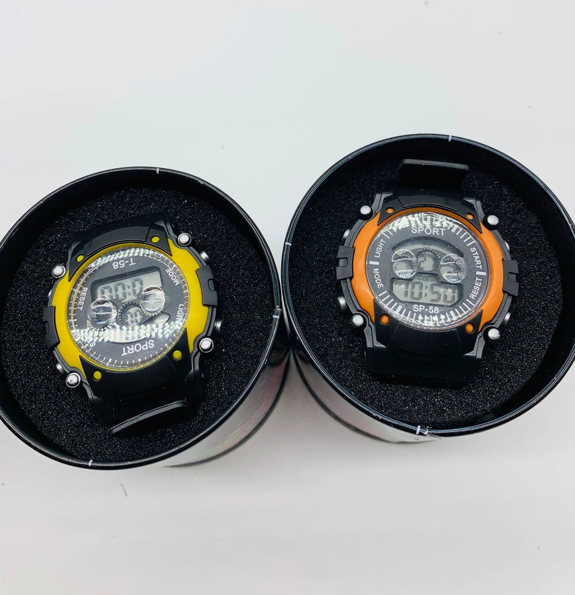 Children's digital sports watch with colourful silicone strap and plastic case, showing alarm and countdown functions.