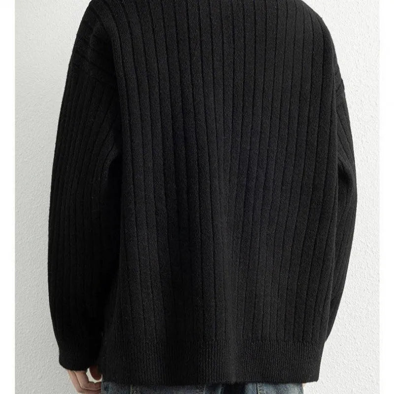 Men's grey half-zip textured knit sweater showing loose fit and long sleeve design