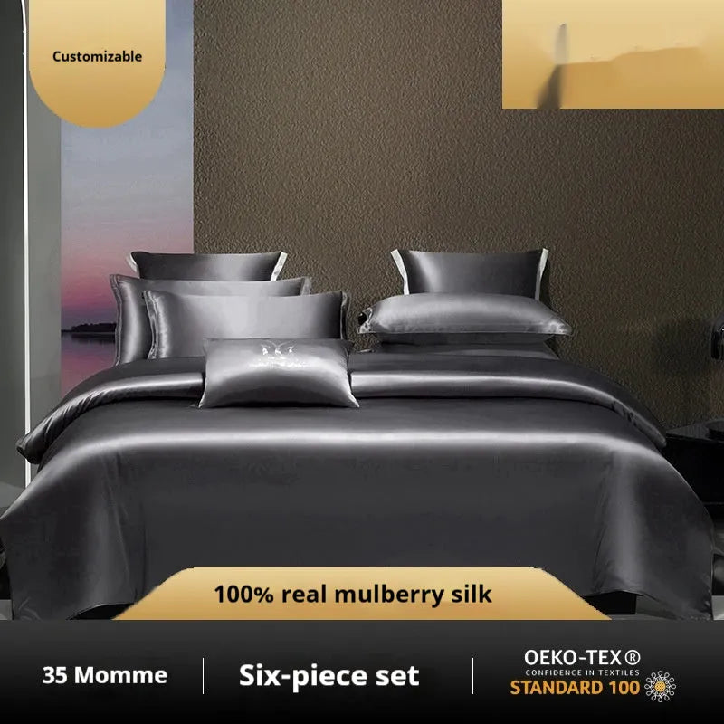 Silk four-piece quilt cover set in solid colour displayed on bed