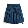 Prussian Blue men's nylon beach shorts with embroidered details and loose fit