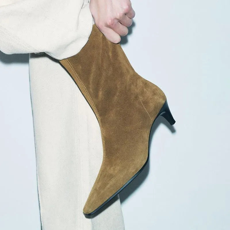 Brown square toe mid heel boots with side zip on a white background.