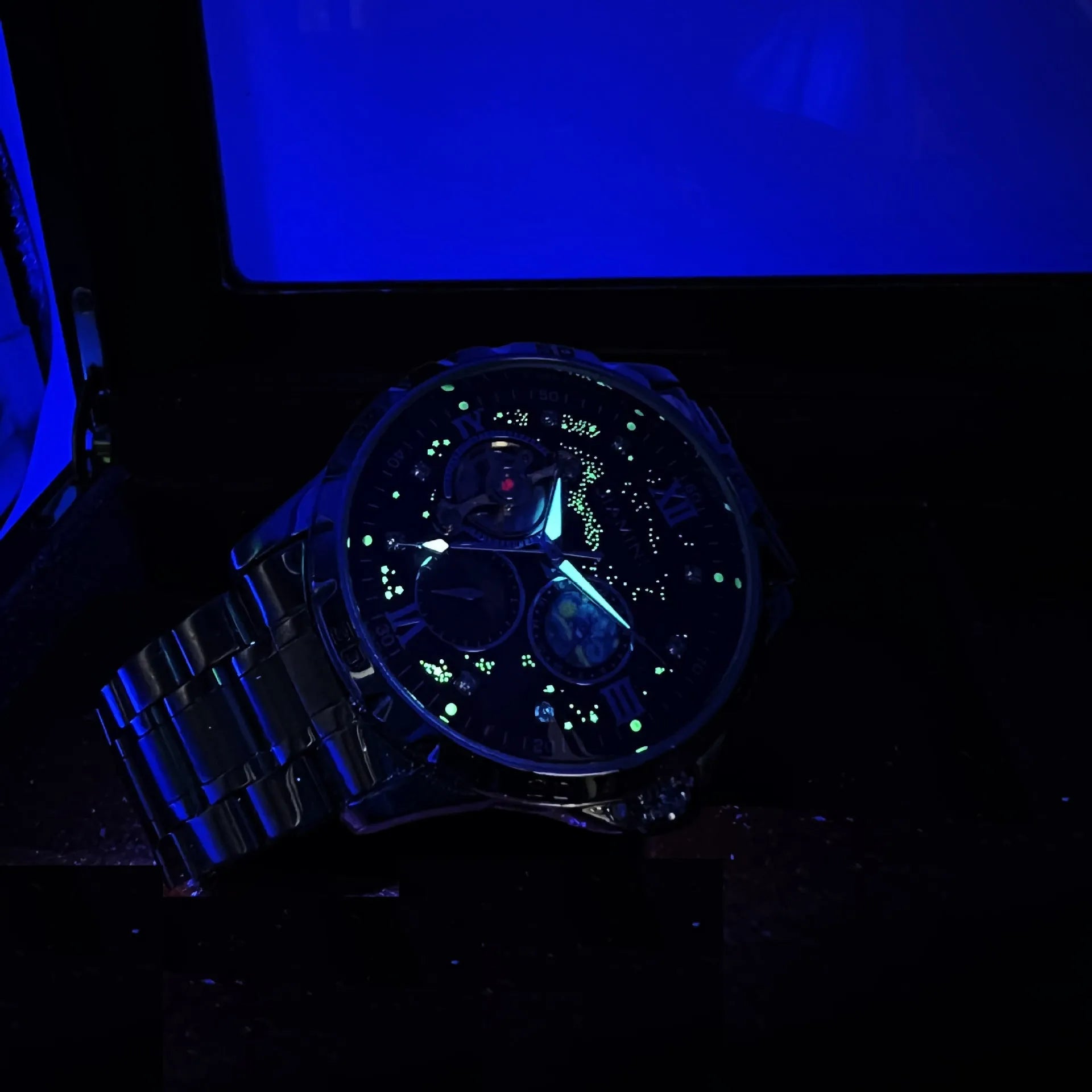 Rose gold automatic mechanical men's watch with black dial and large 44mm case.