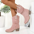 Women's suede mid-calf boot in lotus root colour with leather stitching and a short stout heel.