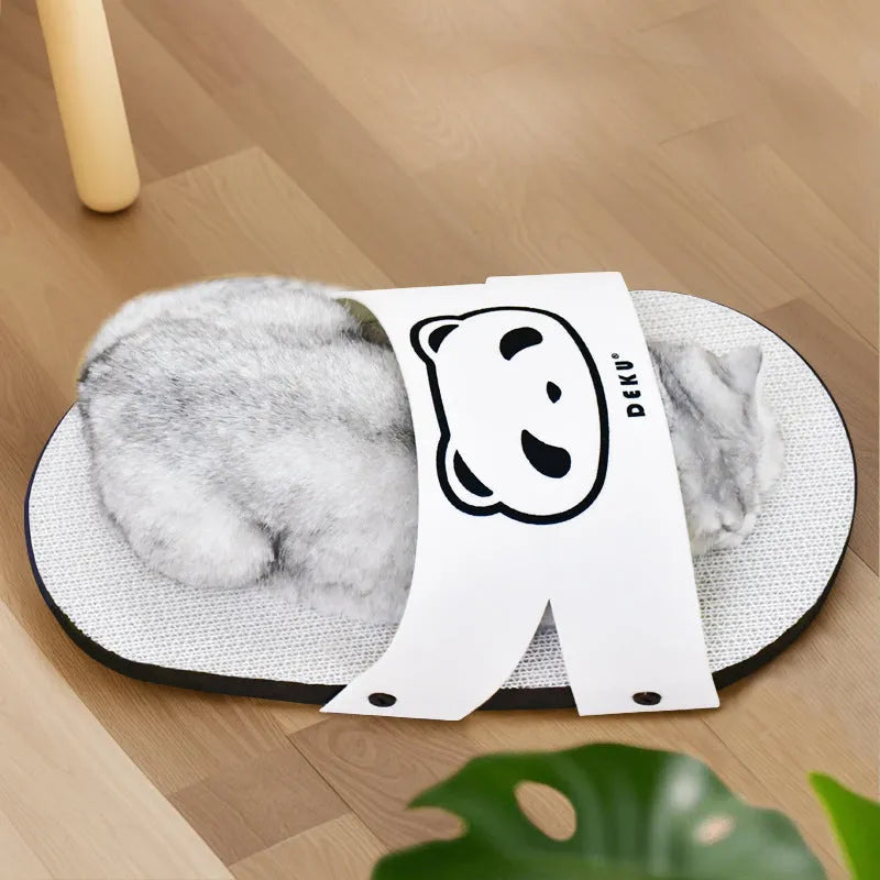 White slipper-style corrugated paper cat scratch board on a floor.
