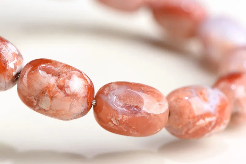 Natural cherry agate barrel bead bracelet with Ruyi design, 10x14mm beads on wrist