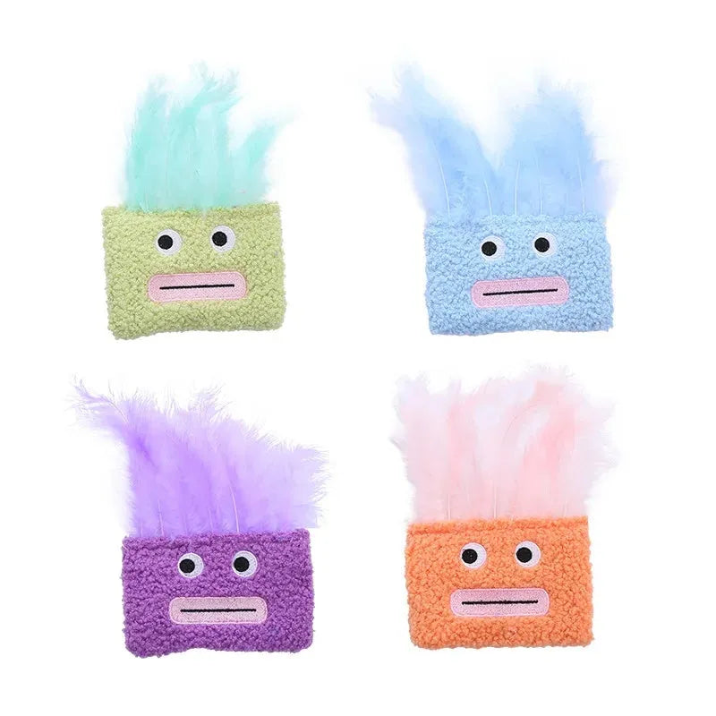 A funny big mouth explosion head shaped catnip plush toy shown in blue, green, orange, and purple colours.