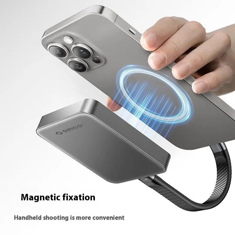 Grey magnetic mobile solid state drive with C to C cable on a desk