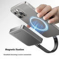 Grey magnetic mobile solid state drive with C to C cable on a desk