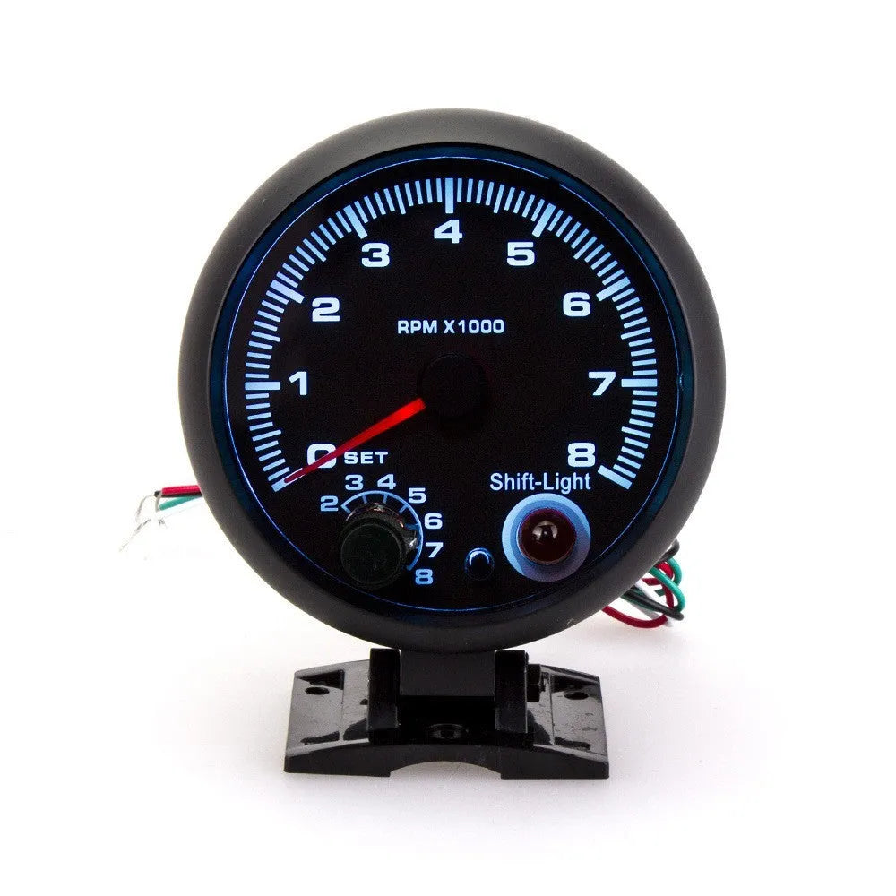 Black automotive tachometer with blue light pointer for car dashboard RPM measurement