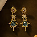 Gold geometric retro stud earrings with diamond treatment and drop design
