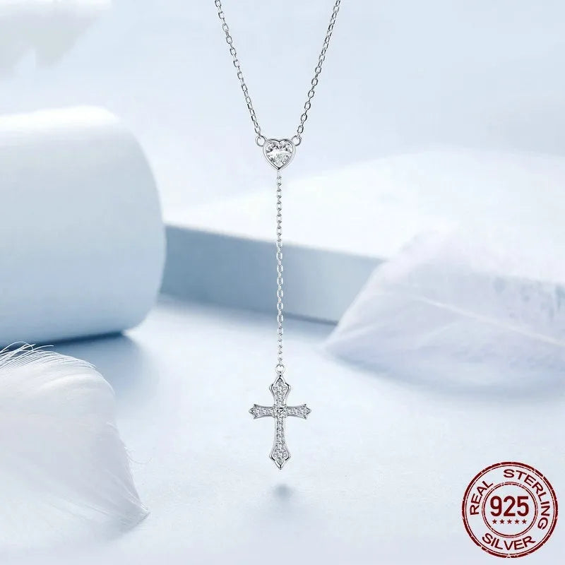 Simple silver love cross pendant necklace with O-ring chain on a female model, colour BSN384.