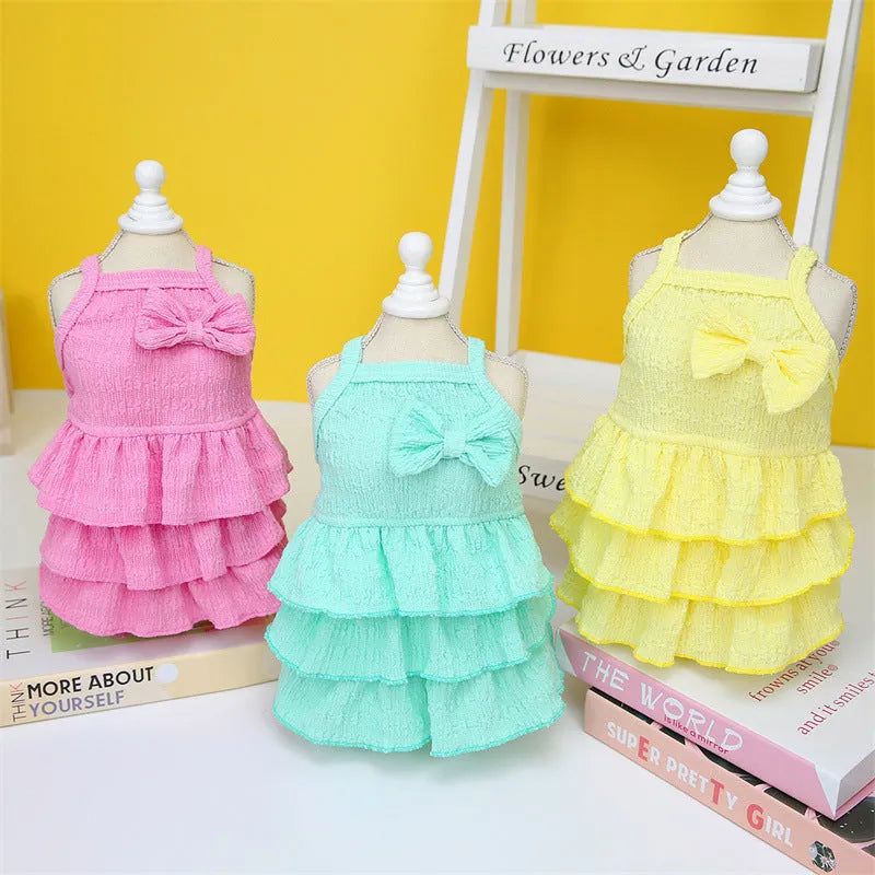 Small dog wearing princess-style dress with candy layered skirt in polyester fabric