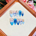 Blue carved transparent fake nails with hand-painted patterns in four sizes