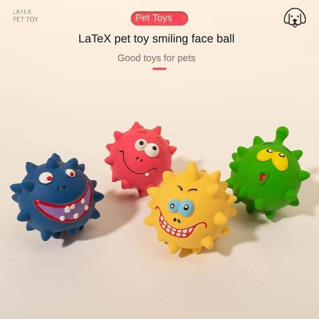 Set of four coloured squeaky dog balls with cute faces on a bumpy latex rubber surface.