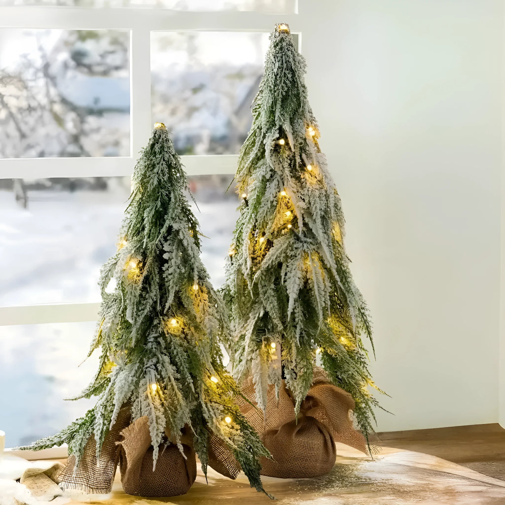 Small 24-inch white plastic Christmas tree with lights and snow sprayer decoration