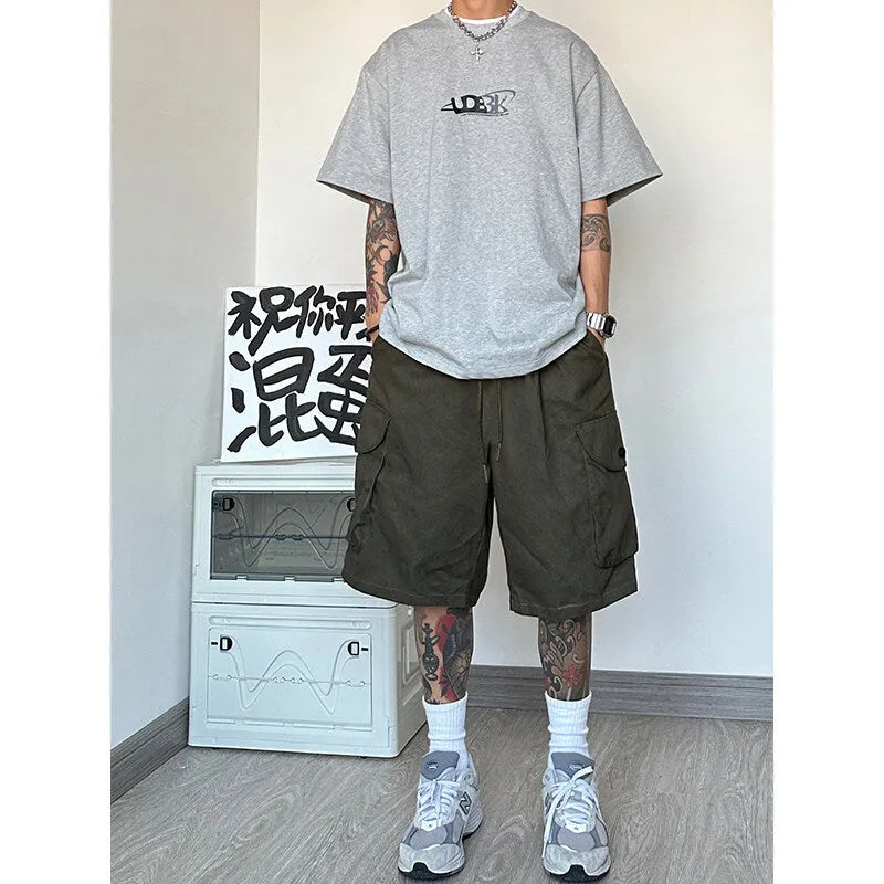 Men's straight-leg sport shorts in polyester fabric available in black, blue, green, and khaki colours