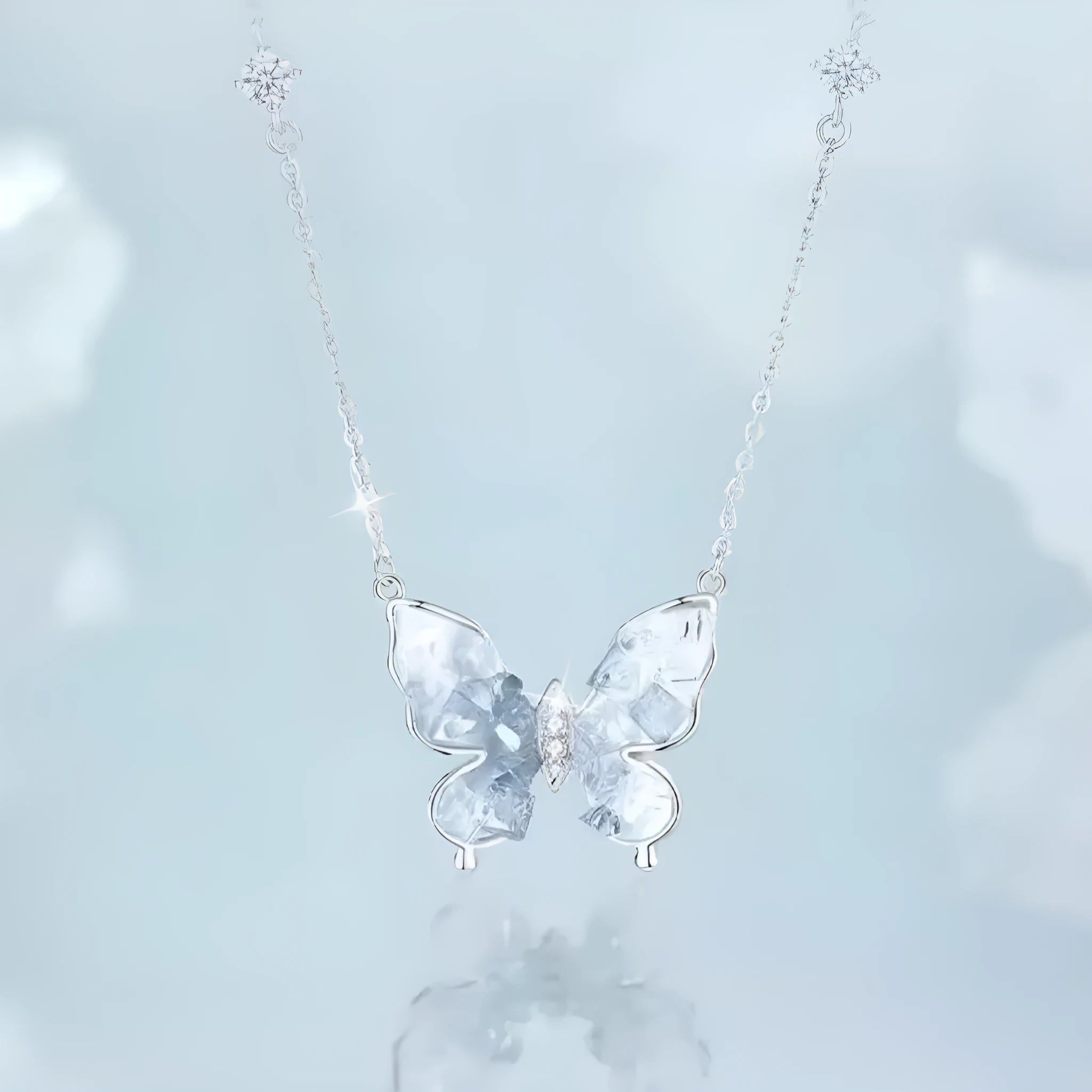 Silver butterfly necklace with adjustable chain showing pendant detail and O-ring links