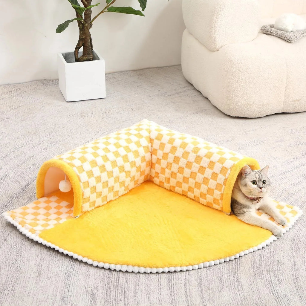 Fan-shaped plush pet bed with central play tunnel in plaid design, shown in coffee colour.