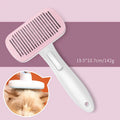 Blue automatic pet hair removal comb on a table, showing its size and one-click button.