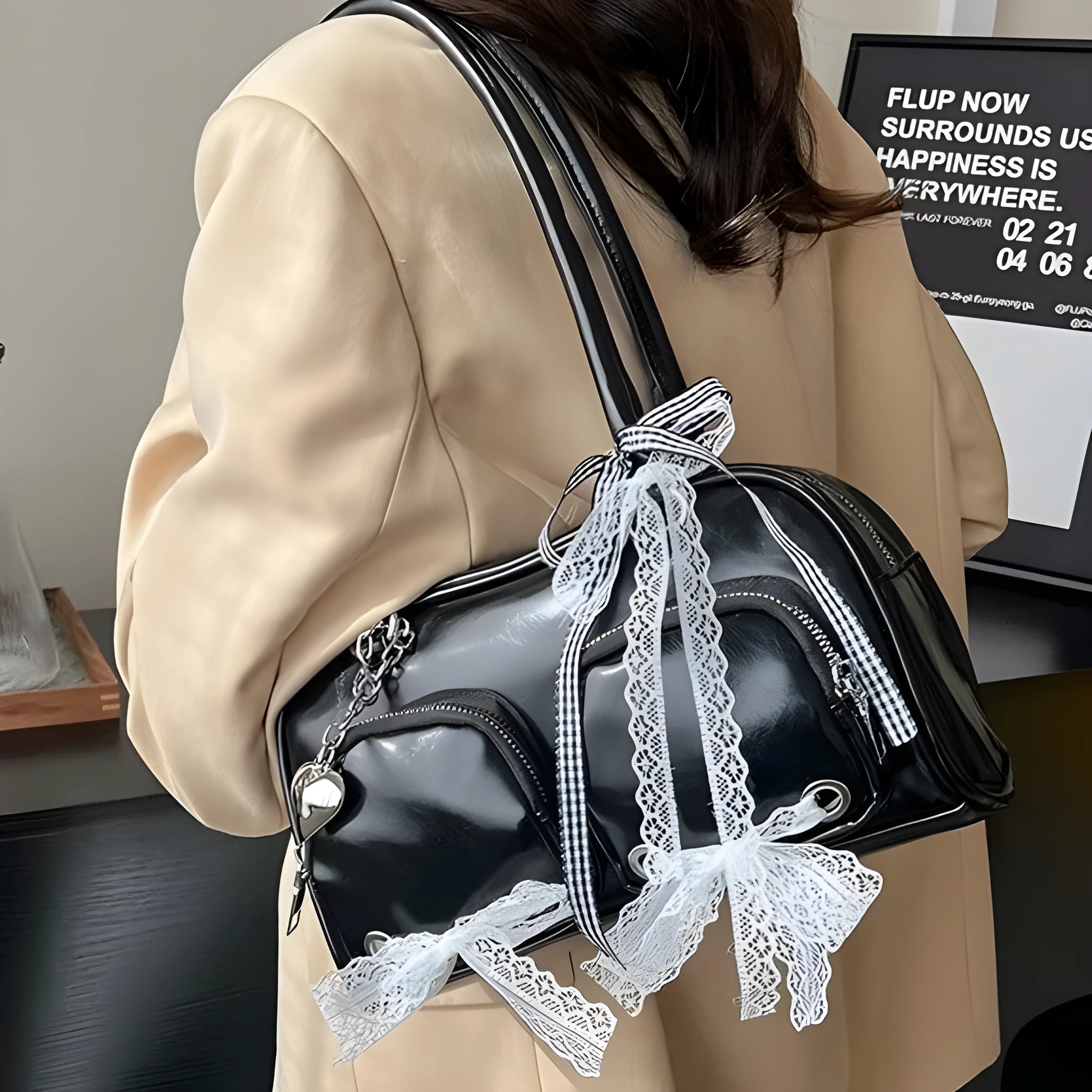 Casual shoulder bag in horizontal square design with cross-body strap, showing internal mobile phone pocket organisation