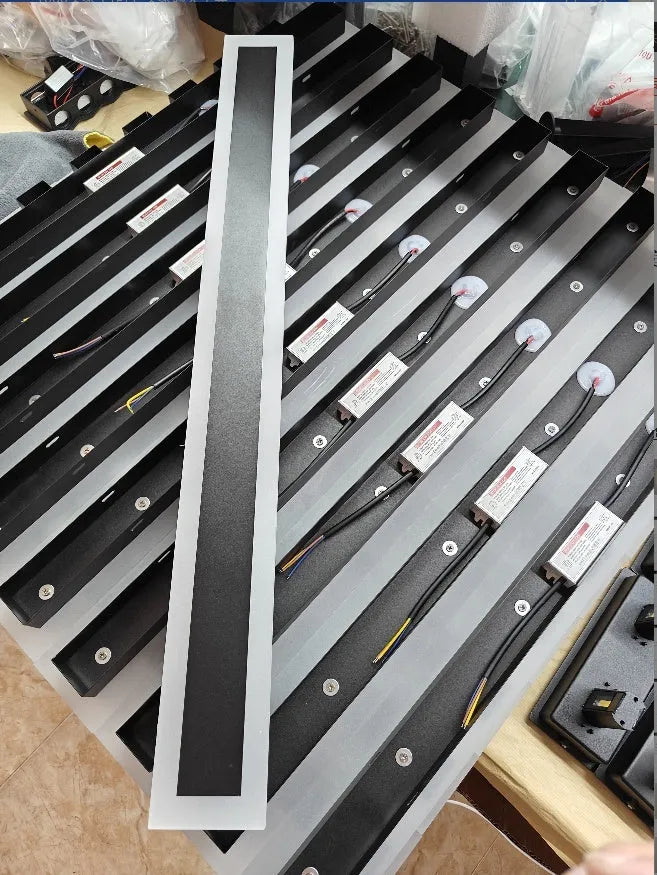Straight outdoor LED wall lamp with IP65 waterproof rating installed on exterior brick wall