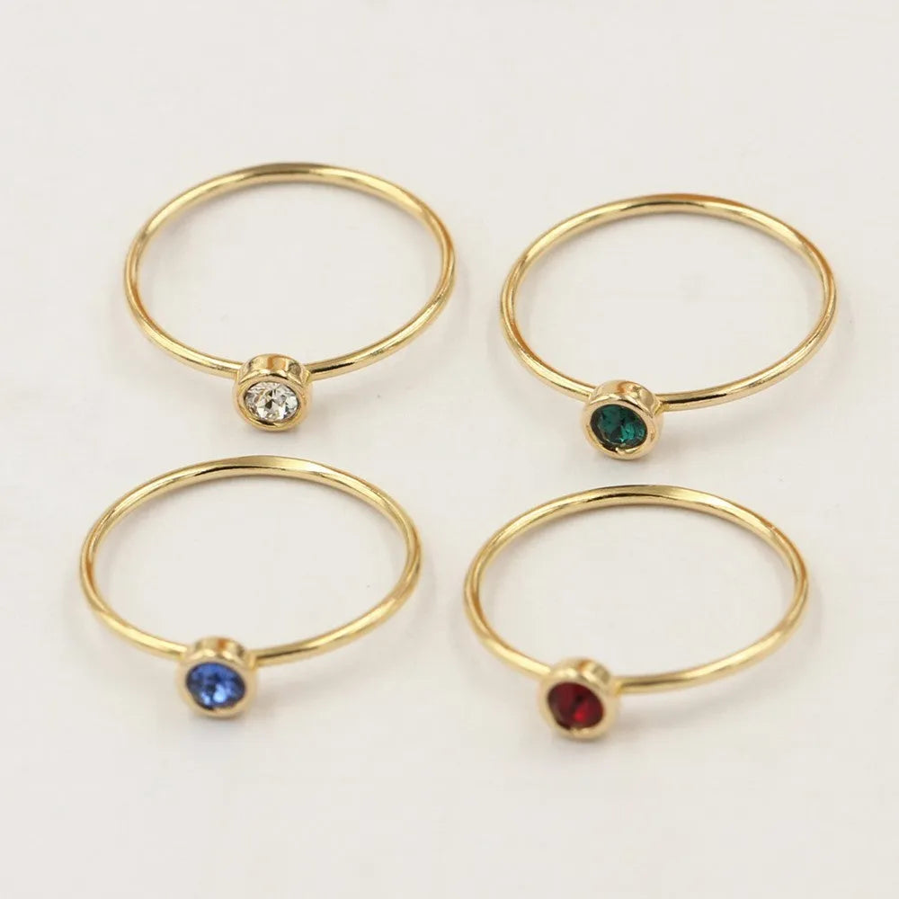 14K gilded GF zircon knuckle ring in green, blue, dark red, or white on a copper base.